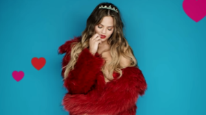 Chrissy Teigen poses in a steamy photoshoot for her hubby on V-Day