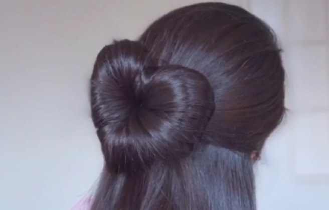 This DIY heart bun hairstyle is the stuff of Valentine’s Day dreams