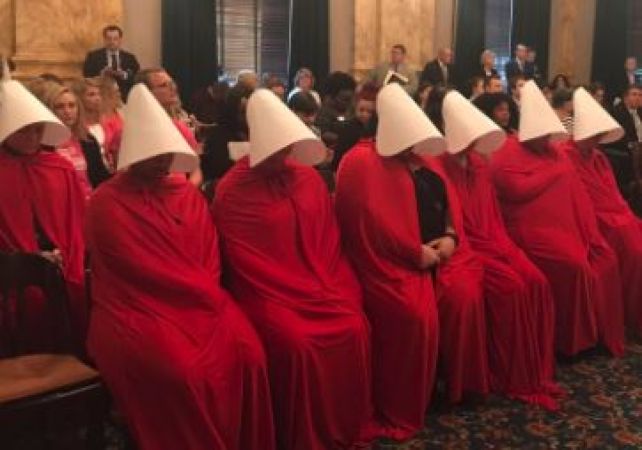 Abortion activists dress as Handmaids to protest legislation