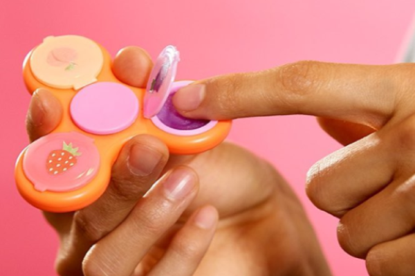 There is fidget spinner lip gloss, and we’re here for it TBH