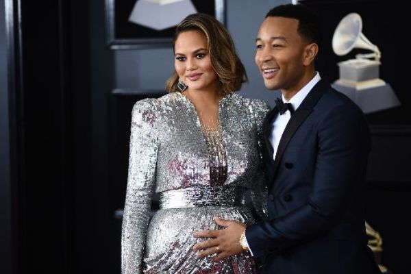 He’s here! Chrissy Teigen shares the first photo her baby boy
