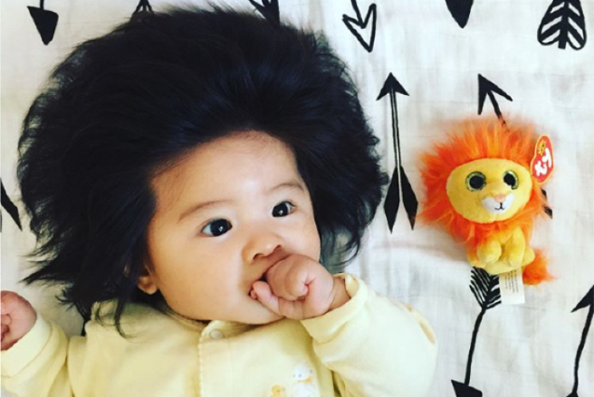 This adorable baby is totally giving us #HairGoals