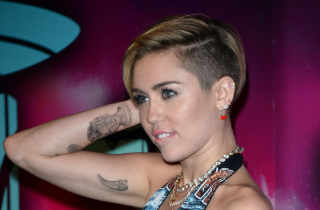 Miley Cyrus got a tattoo of the word ‘p*ssy’, and we want answers