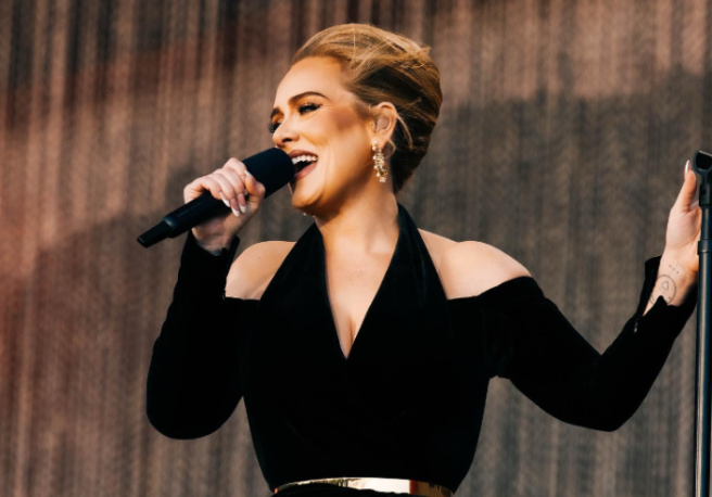 PICS: Adele poses with Emmys trophy as she celebrates at home