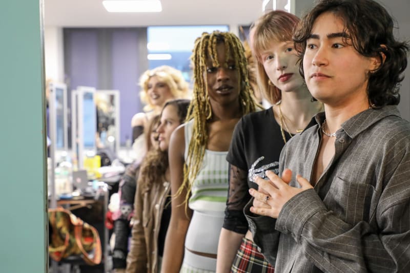 Young models line up backstage at ReStyle Dublin sustainable fashion expo in Dún Laoghaire.