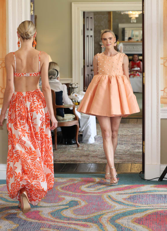 Two models showcase Paul Costelloe Collection dresses at the K Club Afternoon Tea fashion event.